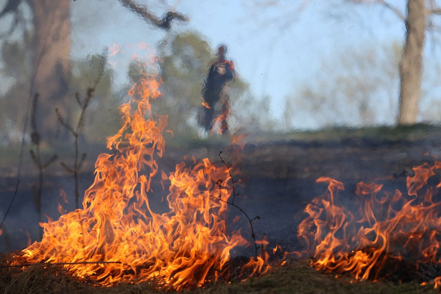 Flames at Oakencroft with silhouette in background